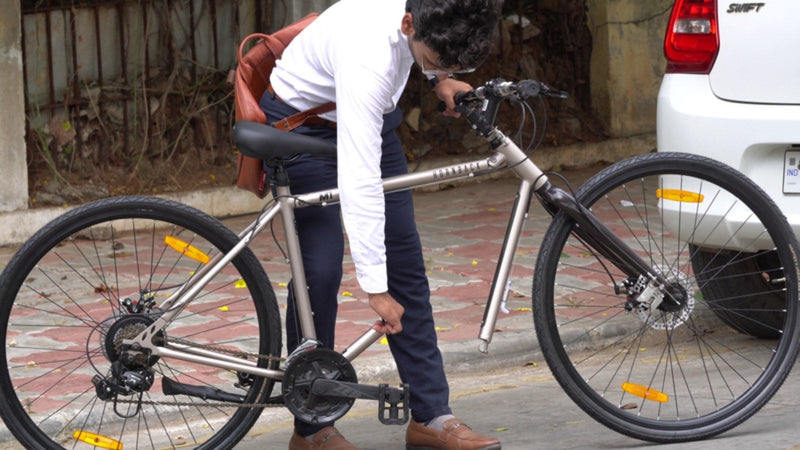 A rider getting his Hornback M1 ready to ride on a city street